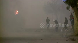 Tunisian street shrouded in tear gas as police clamp down on protests