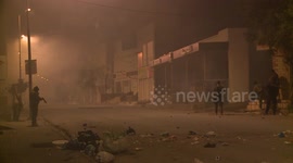 Security forces clash with demonstrators during anti-government protests in Tunisia
