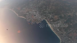 This is the mesmerising footage that shows an incredible group of skydivers soaring through the air in a diagonal line