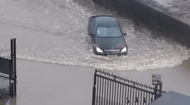 Storm Christoph: Vehicles struggle to pass through submerged roads in Greater Manchester