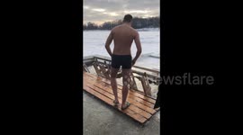Belarusian Orthodox Christians plunge into the ice hole celebrating Epiphany