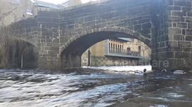 Swollen River Hebden Beck in Hebden Bridge Calderdale