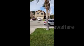 US: Santa Ana Winds Blow Trash Can Away