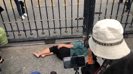 Woman protests outside Thai government building over king’s vast wealth