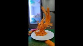Vietnamese man carves a beautiful phoenix from carrots