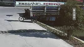 Kind-hearted villagers rescue elderly man after his three-wheeler falls into river