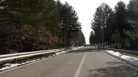 Driving car in a road of Mount Etna