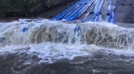 Emergency pumping as heavy rains from Storm Christoph flood the still damaged Toddbrook Reservoir in Whaley Bridge, UK
