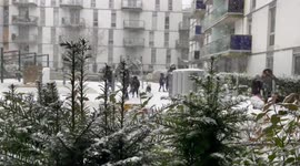 People enjoying snow in London