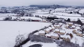 Snow covers the village of Kingswood, Gloucestershire, nestling beneath the Cotswold Escarpment