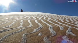 Rare scene as Sahara sand dunes dusted with snow