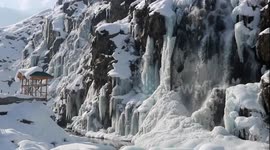 Stunning waterfall freezes over in Kashmir tourist hotspot