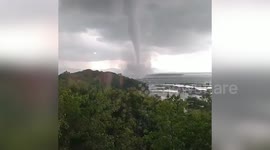 Huge waterspout forms off the coast of Indonesia