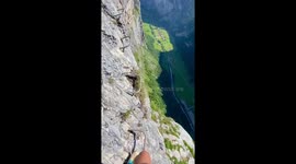 Picturesque Swiss Alps aren't enough to distract from the terrifying heights this climber is scaling