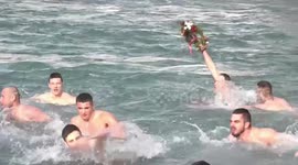 Orthodox Christians in Montenegro celebrate Epiphany by diving into ice-cold river to chase wooden cross