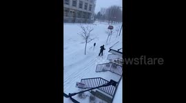 Man takes to skiis to get around heavy Iowa snowfall