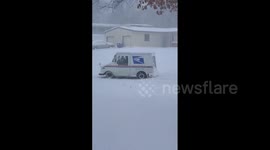 USPS driver excellently maneuvers truck despite winter snowstorm