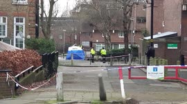 Police cordon off scene of fatal stabbing of teenage boy in north London