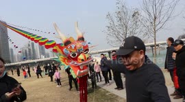 Chinese man tests his DIY dragon kite that is over 100-metres-long