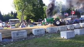 Tractor breaks apart and catches fire at pulling evening