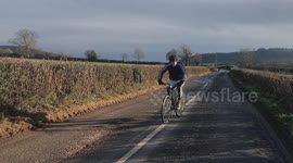 BEZ KEEPING FIT ON PUSHBIKE AS PART OF HIS BUZZING WITH BEZ FITNESS VIDEO