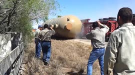 Oversized truck and vessel flip over after trailer breaks apart in Mexico