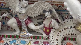 Colourful cartoon characters decorate Buddhist temple in Thailand