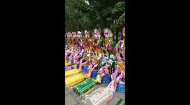 Vietnamese people burn giant paper dummies for souls of dead