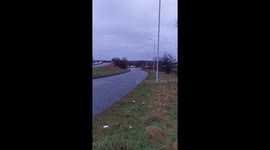 Car stranded in deep floodwater main road wirral Merseyside UK. Fire rescue service attended with police.