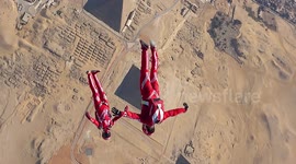 Watch daredevils soar above Egyptian pyramids