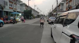 Buying lottery tickets from a blind man in Thailand.