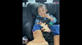 Sleeping Toddler in Car Seat Attempts to Eat