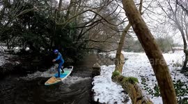 Board-om! UK man paddleboards through snowy countryside to cure 'cabin fever'