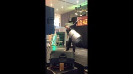 Man swinging a beer keg from his ears!!