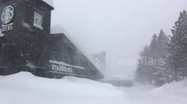 Heavy snowfall almost buries this Starbucks in California