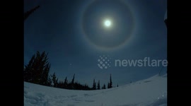 Guy films particularly impressive moon halo forming while camping in the British Columbia mountains