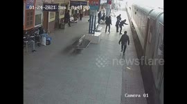 Indian commuter survives after falling in gap between platform and moving train