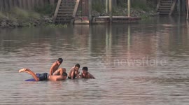 Four young boys get into a boat-load of trouble on river in Thailand