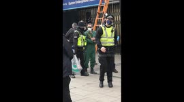 HS2 protest: Activist hauled away by police after climbing onto roof of Euston Station
