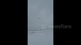 Chicagoans enjoy kiteboarding amid winter storm