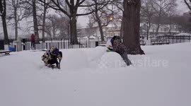 NYC family builds snowman amid heavy first storm of 2021