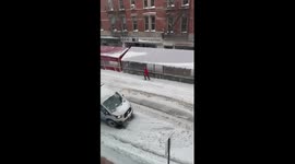 Skiing in Manhattan. New Yorker finds an unorthodox way to move around the streets as historic blizzard hits the city