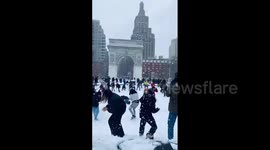 Massive snowball fight ensues in New York at Washington Square Park
