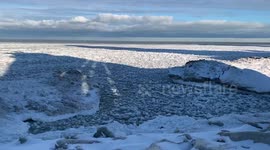 Chunks of ice ripple on Lake Michigan as winter storm grips Chicago