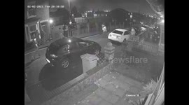 CCTV captures a neighbour chasing off sword and machete wielding thugs with a garden spade.
