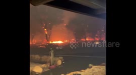Raging bushfire surrounds home near Perth as more than 70 homes destroyed
