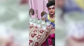 Young artist lifts nearly one thousand razor blades with his eyelashes in southern India