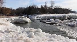 Man fishes on huge ice blocks on Lake Huron