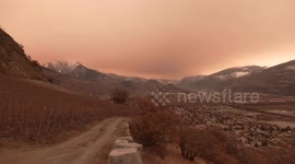 Sahara dust plume gives Swiss mountains an eerie, orange-tinged backdrop