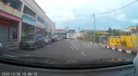 Motorcycle rider pulls off impressive ‘drift’ to avoid crash